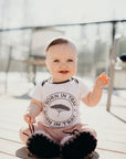 Organic baby onesie in white with grey "Born in Tbay" logo on front
