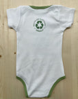 Babies organic onesie in white with green text that states: "Save the bees, plant trees & protect our seas"
