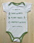 Babies organic onesie in white with green text that states: "Save the bees, plant trees & protect our seas"
