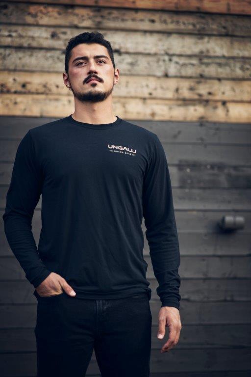 Black organic long sleeve unisex shirt with text that reads: "Dream big. Work hard." on the back