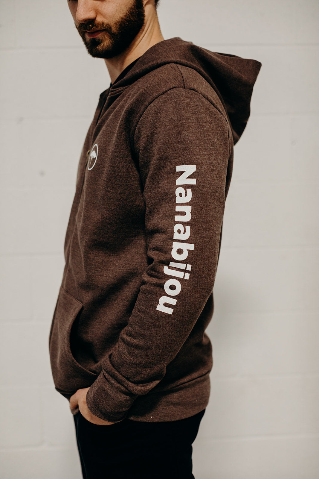 Brown organic unisex zip up hoodie with multi coloured  'Nanabijou' design and white text