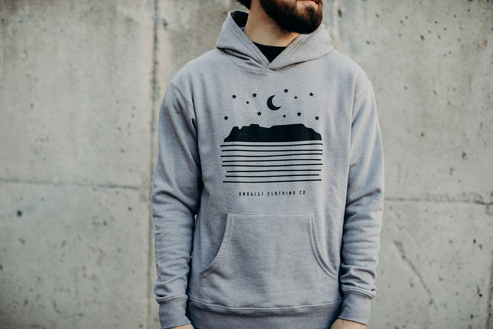 Grey unisex pull over hoodie with black Sleeping Giant design