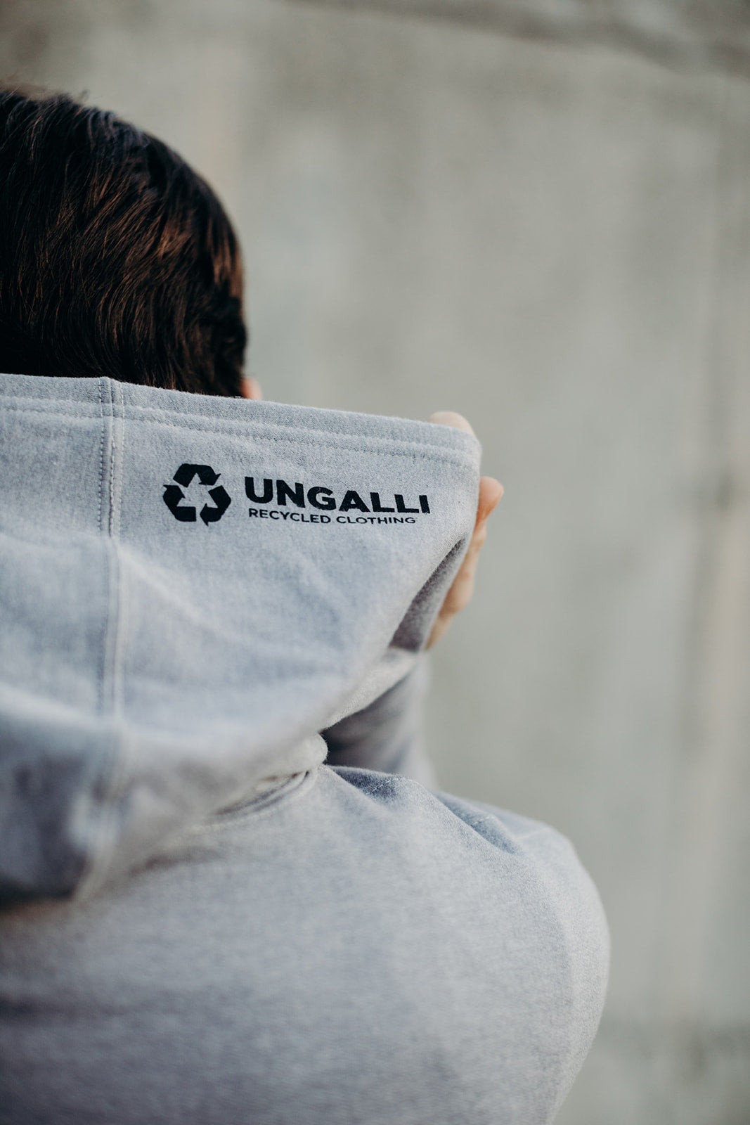Grey unisex pull over hoodie with black Sleeping Giant design