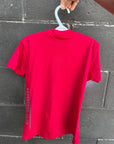 Kids red organic t-shirt with multi coloured 'adventure club' logo