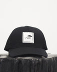Unisex recycled snap back hat in grey or black with white Ungalli logo on front