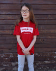 Children's recycled red t-shirt with white accents and sleeping giant outline across front