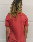 Unisex sustainably made red t-shirt with small white ungalli tree on front