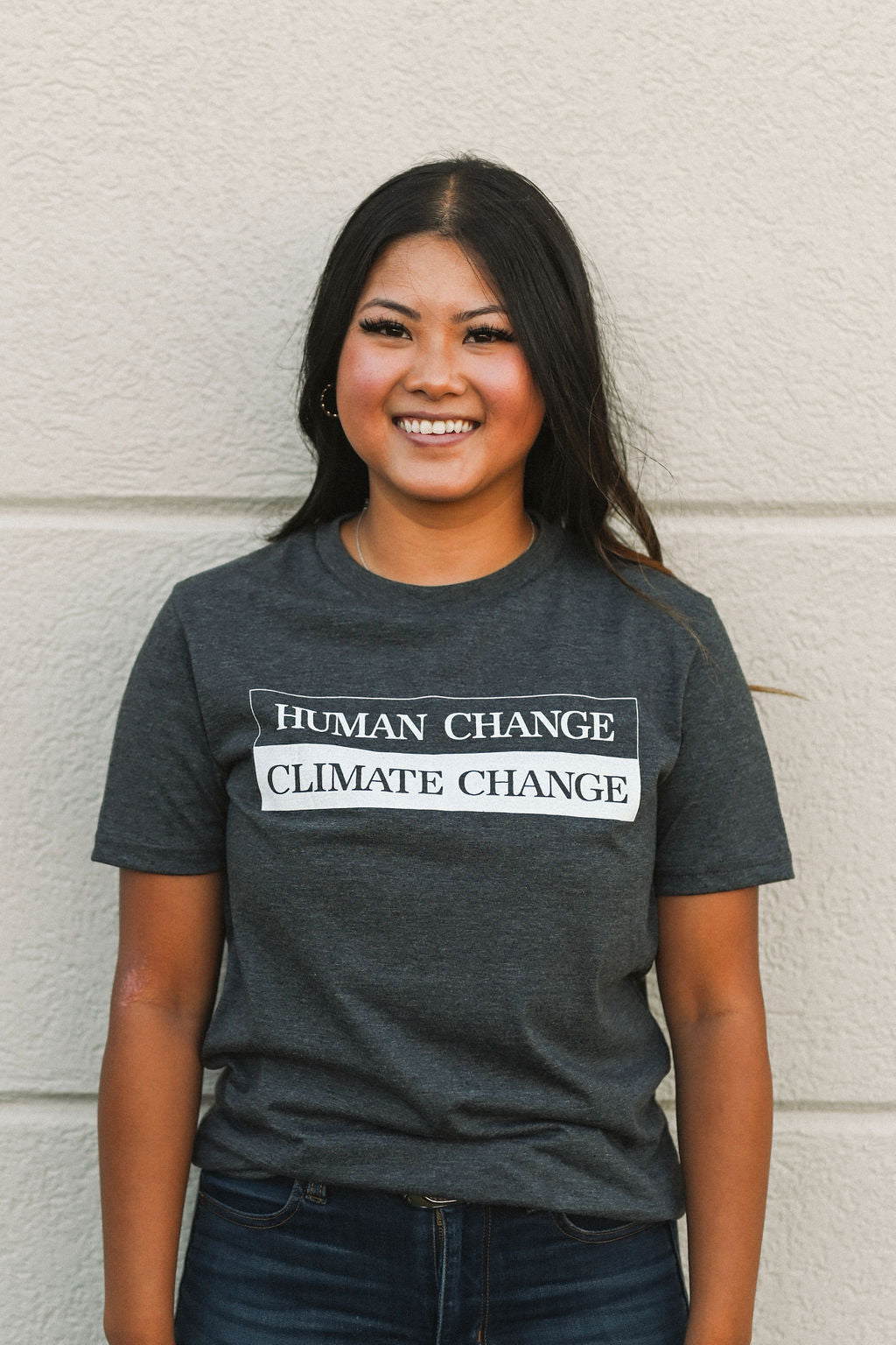 Recycled grey short sleeve unisex t-shirt with text on front that reads: "human change climate change"