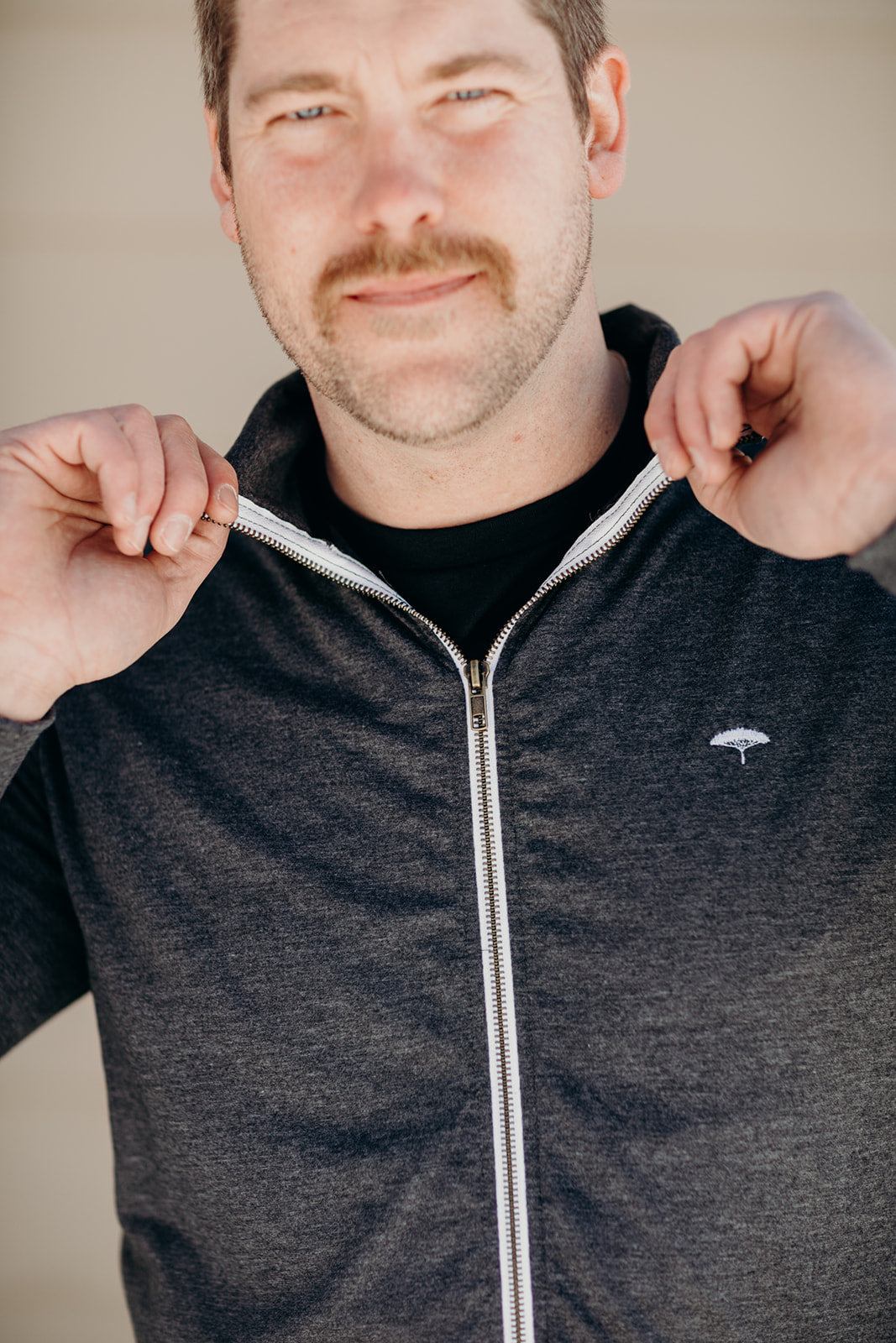 Unisex recycled hoodless grey zip up sweater with Sleeping Giant design on back