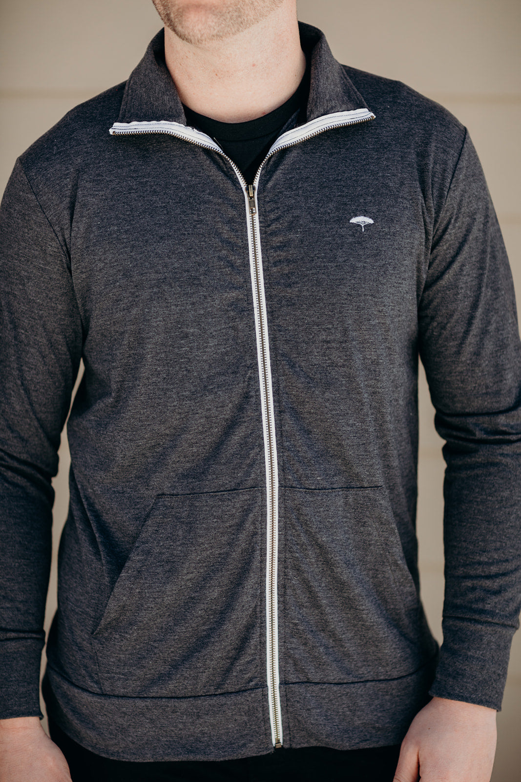 Unisex recycled hoodless grey zip up sweater with Sleeping Giant design on back