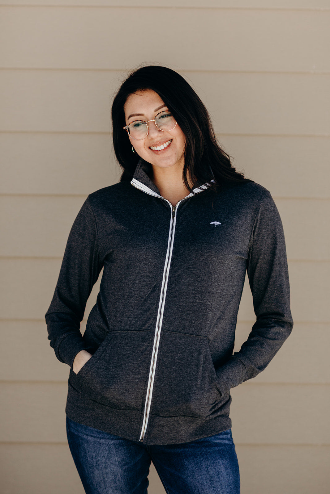 Unisex recycled hoodless grey zip up sweater with Sleeping Giant design on back