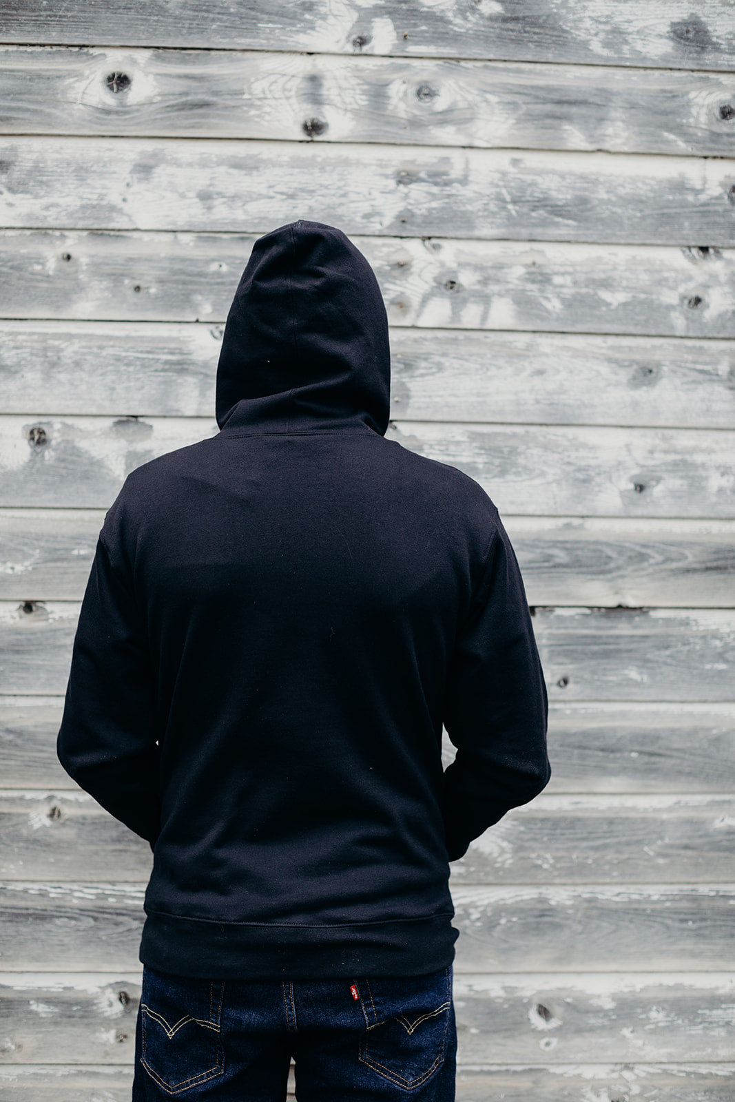 Black organic unisex hoodie with white 'Port Arthur' logo