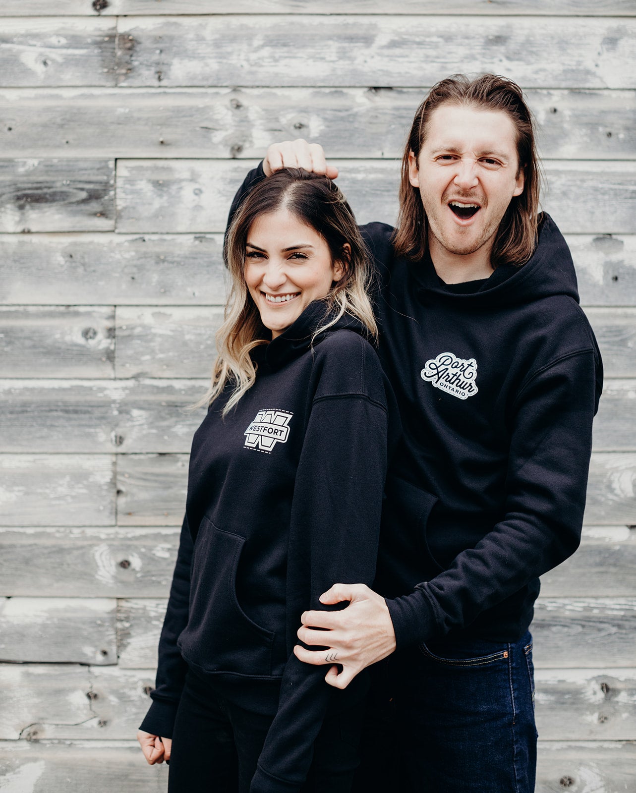 Black organic unisex hoodie with white 'Port Arthur' logo