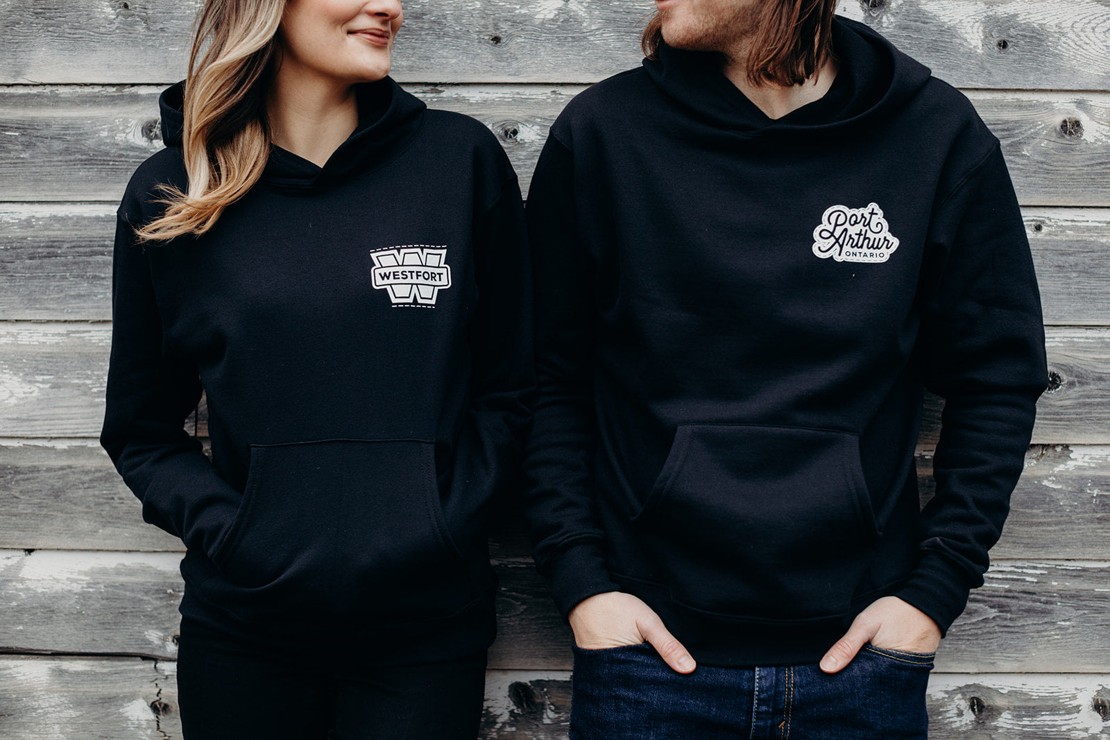 Black organic unisex hoodie with white 'Port Arthur' logo
