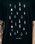 Unisex black organically made t-shirt with white tree design across front