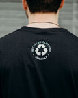 Unisex black organically made t-shirt with white tree design across front