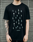 Unisex black organically made t-shirt with white tree design across front