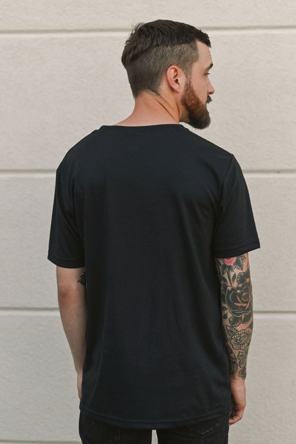 Ethically made unisex t-shirt in black with small white Ungalli tree on front