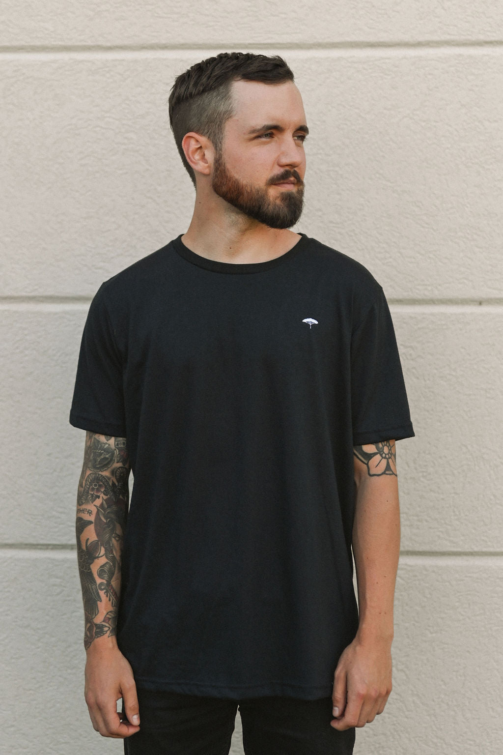 Ethically made unisex t-shirt in black with small white Ungalli tree on front