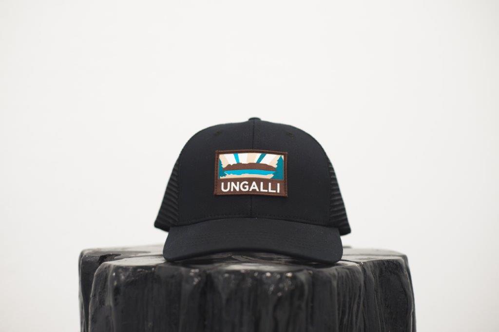 Unisex organic snap back hat in grey or black with multicoloured Ungalli/sleeping giant design on front