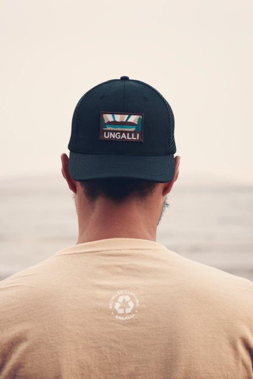 Unisex organic snap back hat in grey or black with multicoloured Ungalli/sleeping giant design on front