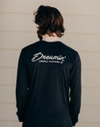 Unisex recycled long sleeve black shirt with Dreamin' airplane design on front and text on back