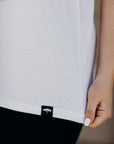 Organic white unisex t-shirt with multi-coloured dreamin' plane logo on front
