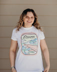 Organic white unisex t-shirt with multi-coloured dreamin' plane logo on front