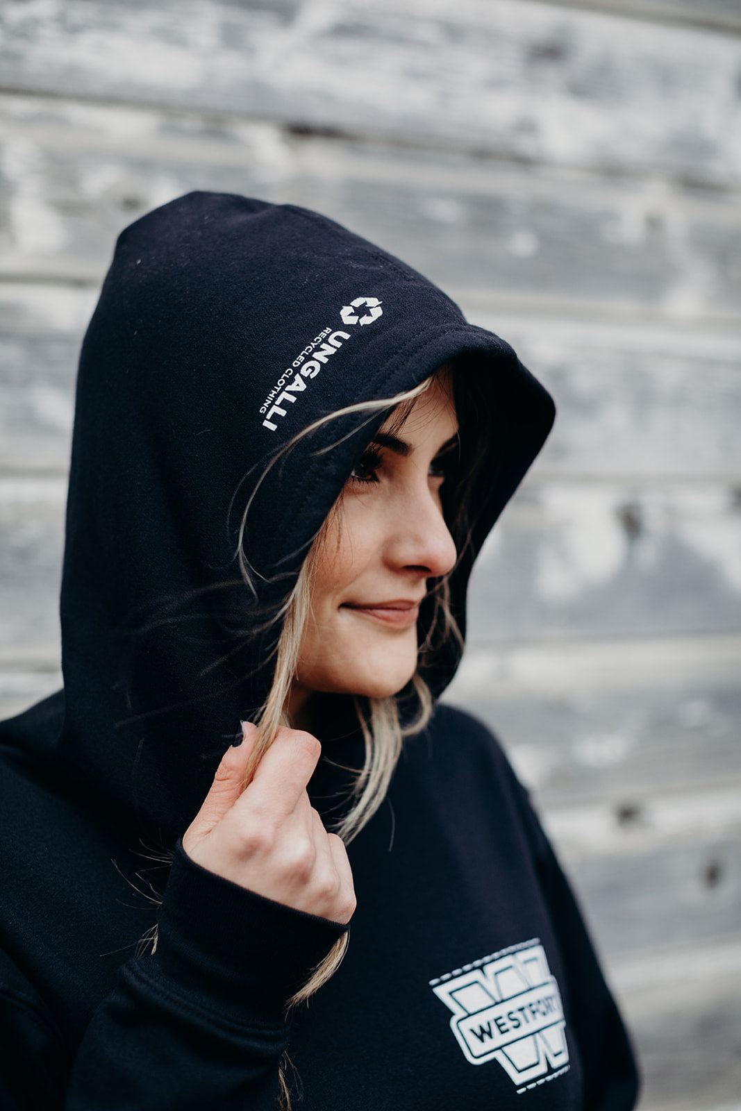 Unisex sustainably made black hoodie with white 'westfort' logo