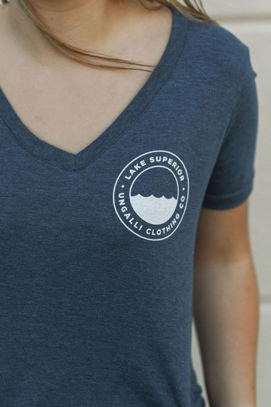 Women's blue recycled v neck t-shirt with white Lake Superior logo