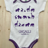 Organic baby onesie in white with purple accents and animal design
