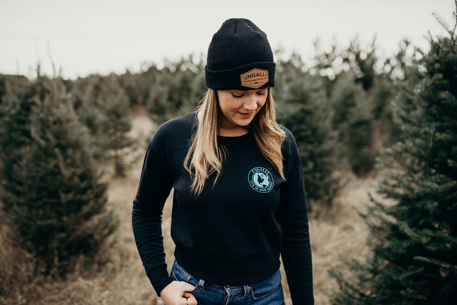 Women's sustainably made black cropped hoodie with brand logo