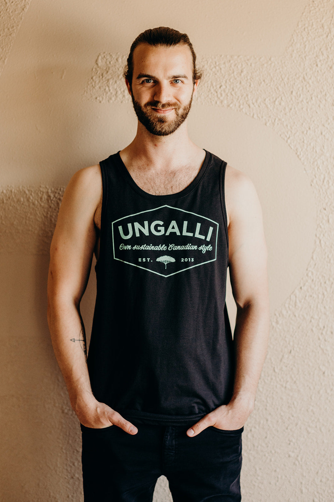 Men's recycled black tank top with mint green Ungalli design on front