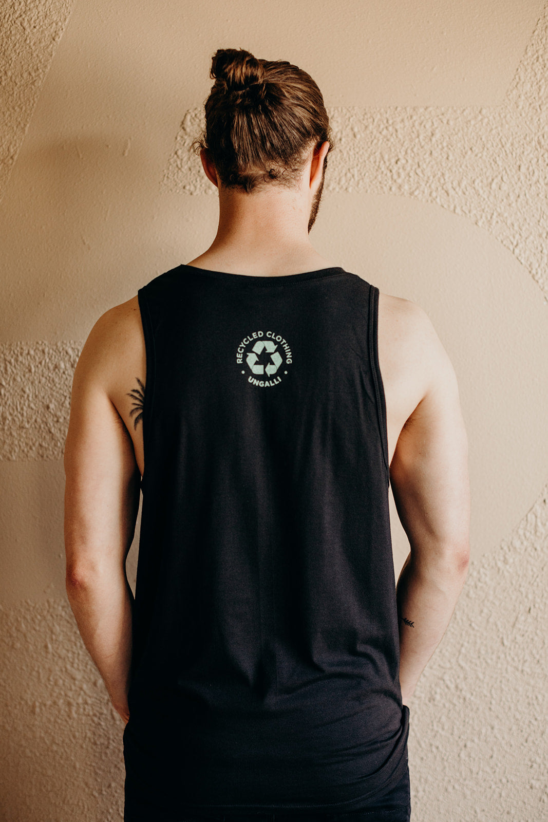 Men's recycled black tank top with mint green Ungalli design on front