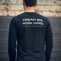 Black organic long sleeve unisex shirt with text that reads: "Dream big. Work hard." on the back