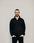 Unisex ethically made black 1/4 zip sweater with small white Ungalli tree on front