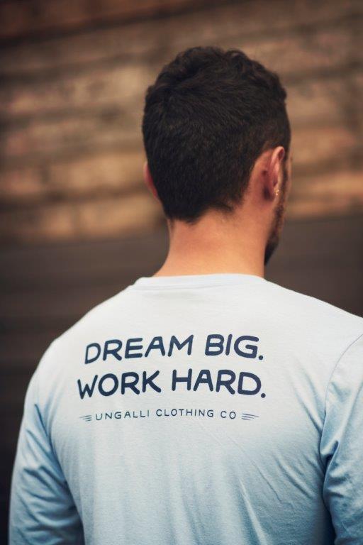Ethically made unisex blue skies long sleeve shirt with text on back reading: "Dream big. Work hard."