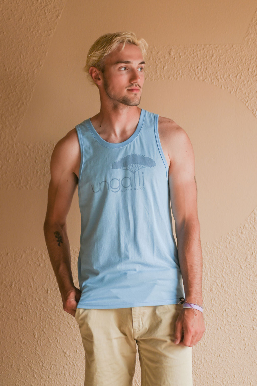 Light blue men's tank top with but Ungalli logo across front