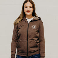 Brown ethically made unisex zip up hoodie with white "in our hands'" logo