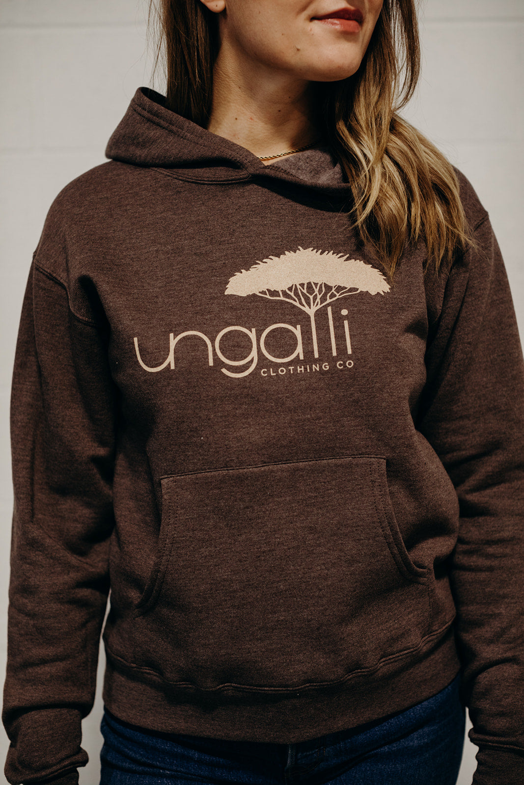 Brown ethically made unisex pull over hoodie with beige Ungalli logo