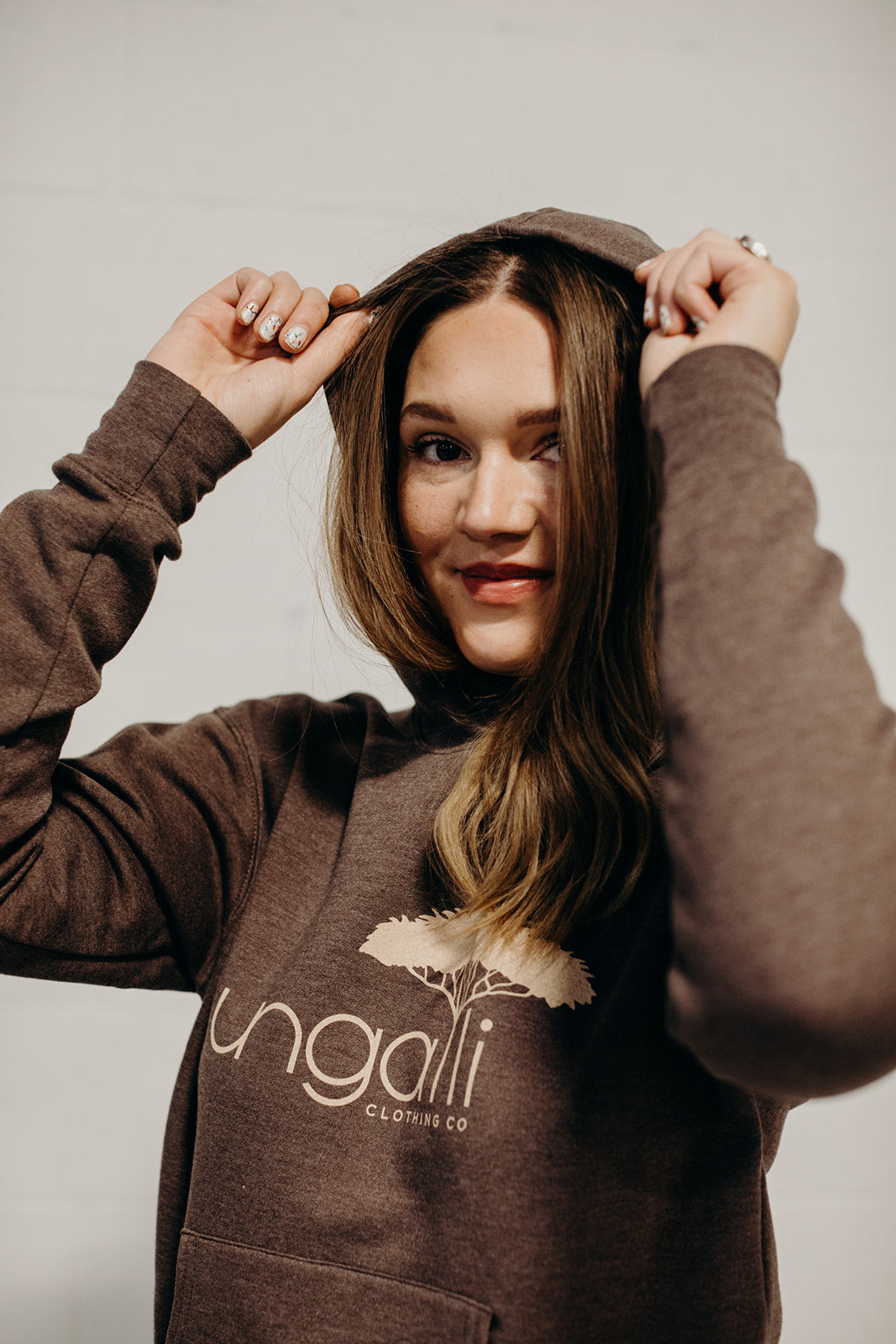 Brown ethically made unisex pull over hoodie with beige Ungalli logo