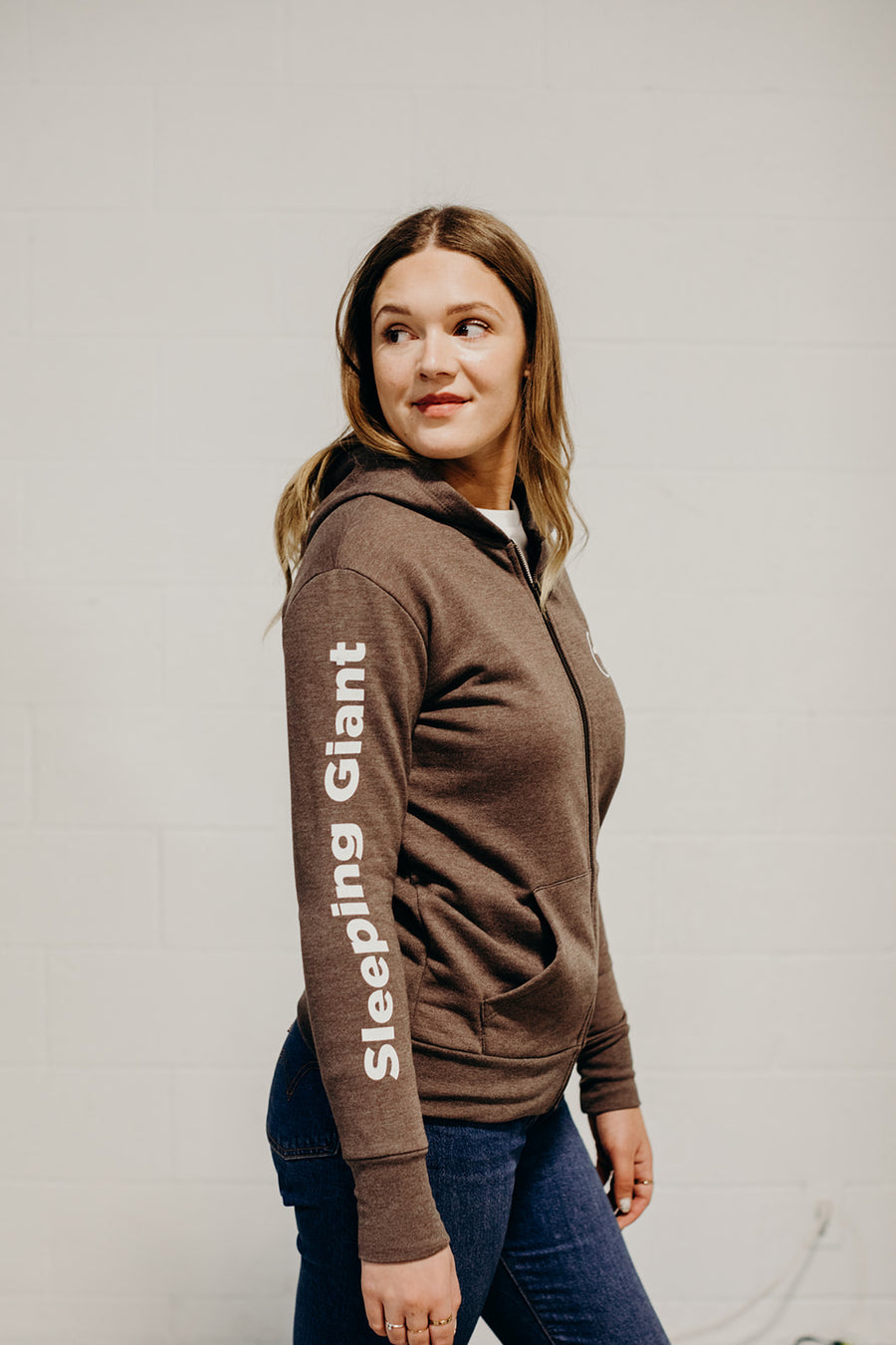 Brown organic unisex zip up hoodie with multi coloured  'Nanabijou' design and white text