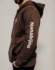 Brown organic unisex zip up hoodie with multi coloured  'Nanabijou' design and white text