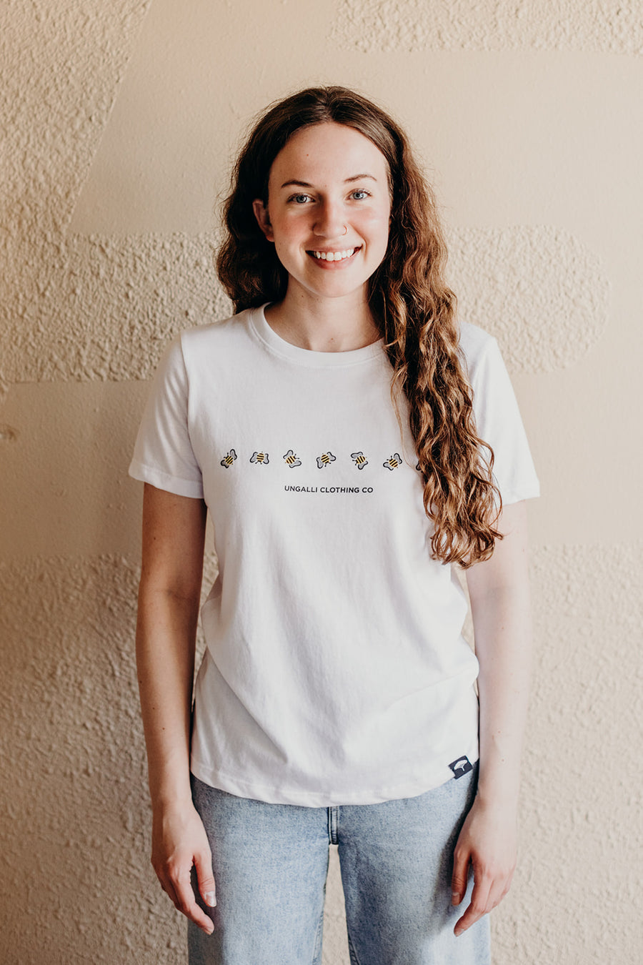 Women's white organically made t-shirt with bee design on front 