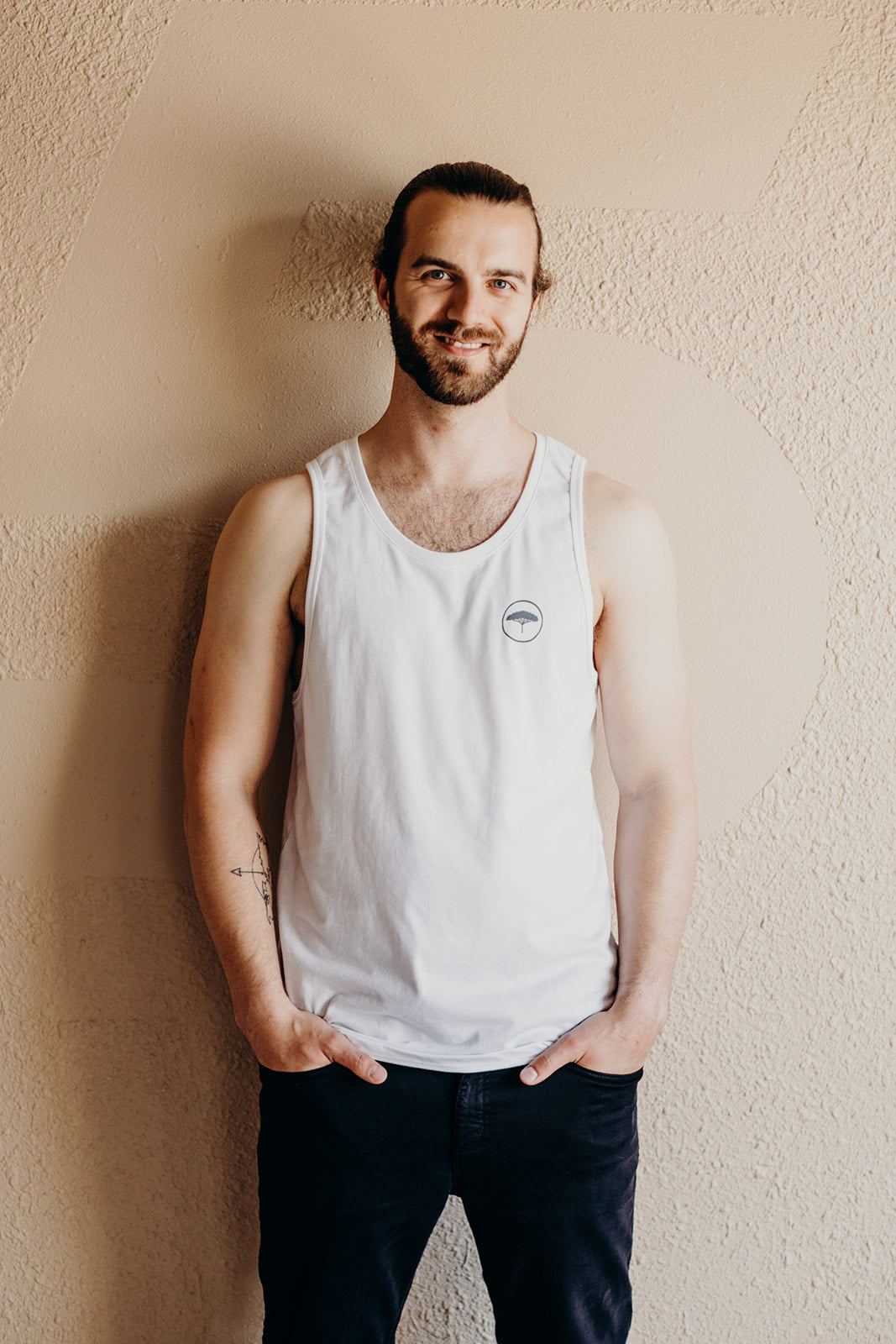 Men's recycled white tank top with small grey Ungalli logo on front
