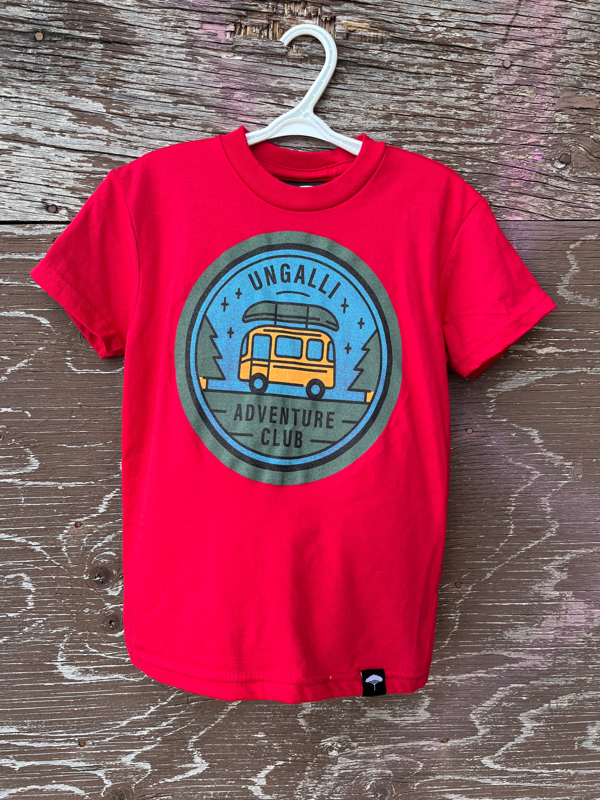 Kids red organic t-shirt with multi coloured 'adventure club' logo