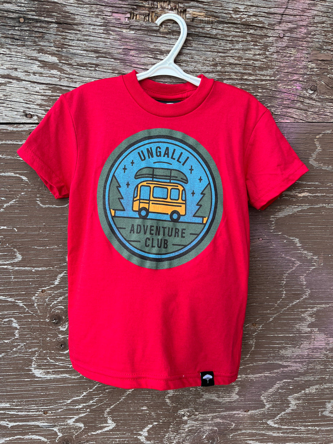 Kids red organic t-shirt with multi coloured 'adventure club' logo