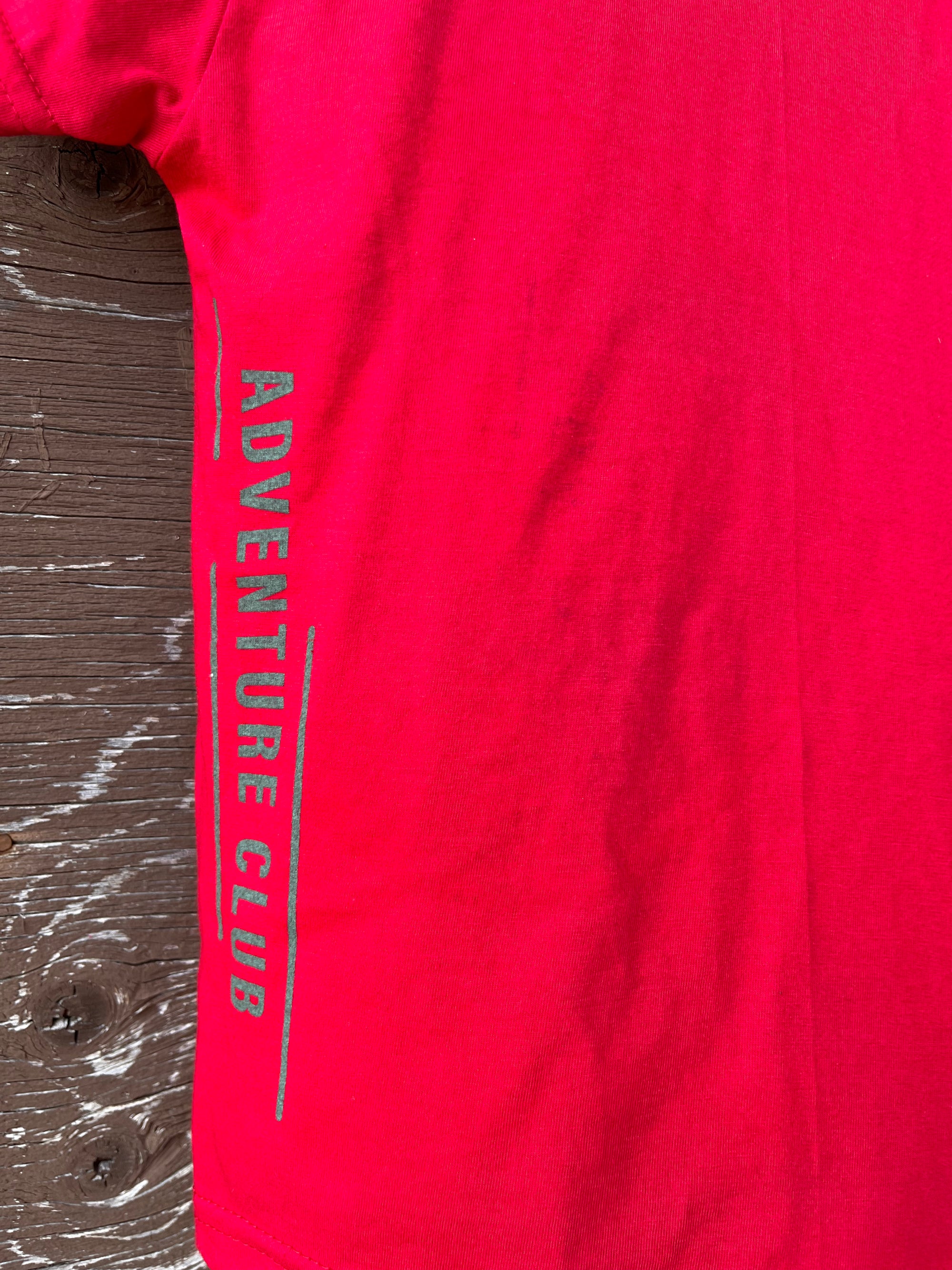 Kids red organic t-shirt with multi coloured 'adventure club' logo