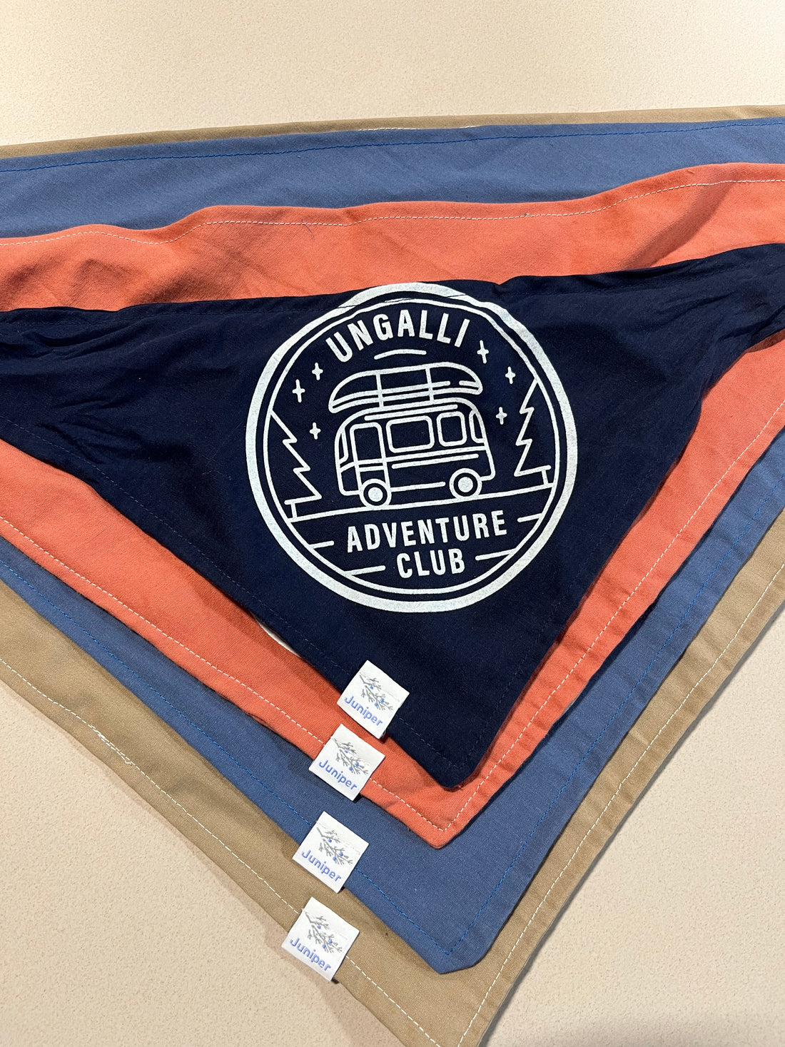 Dog bandana available in multiple colours with white adventure club logo