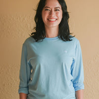 Light blue recycled unisex long sleeve shirt with small white Ungalli tree on front